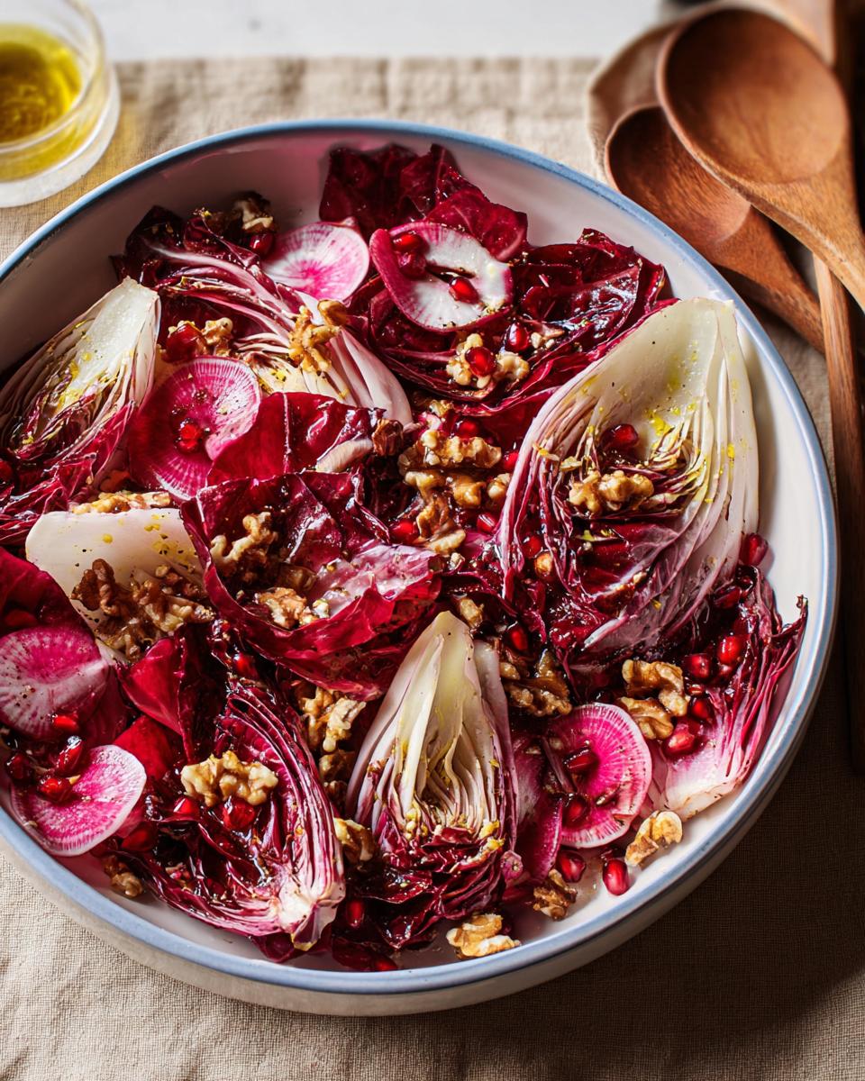 A colorful Thanksgiving salad recipe featuring radicchio, radishes, walnuts, and pomegranate seeds in a bowl.