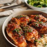 A close-up of glazed chicken pieces served with rice, part of an easy dinner recipe.
