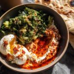 A healthy meal recipe featuring poached eggs with greens and chili oil, served with flatbread.