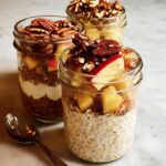 Three jars filled with overnight oats, apples, yogurt, and pecans, showcasing healthy meals recipes.