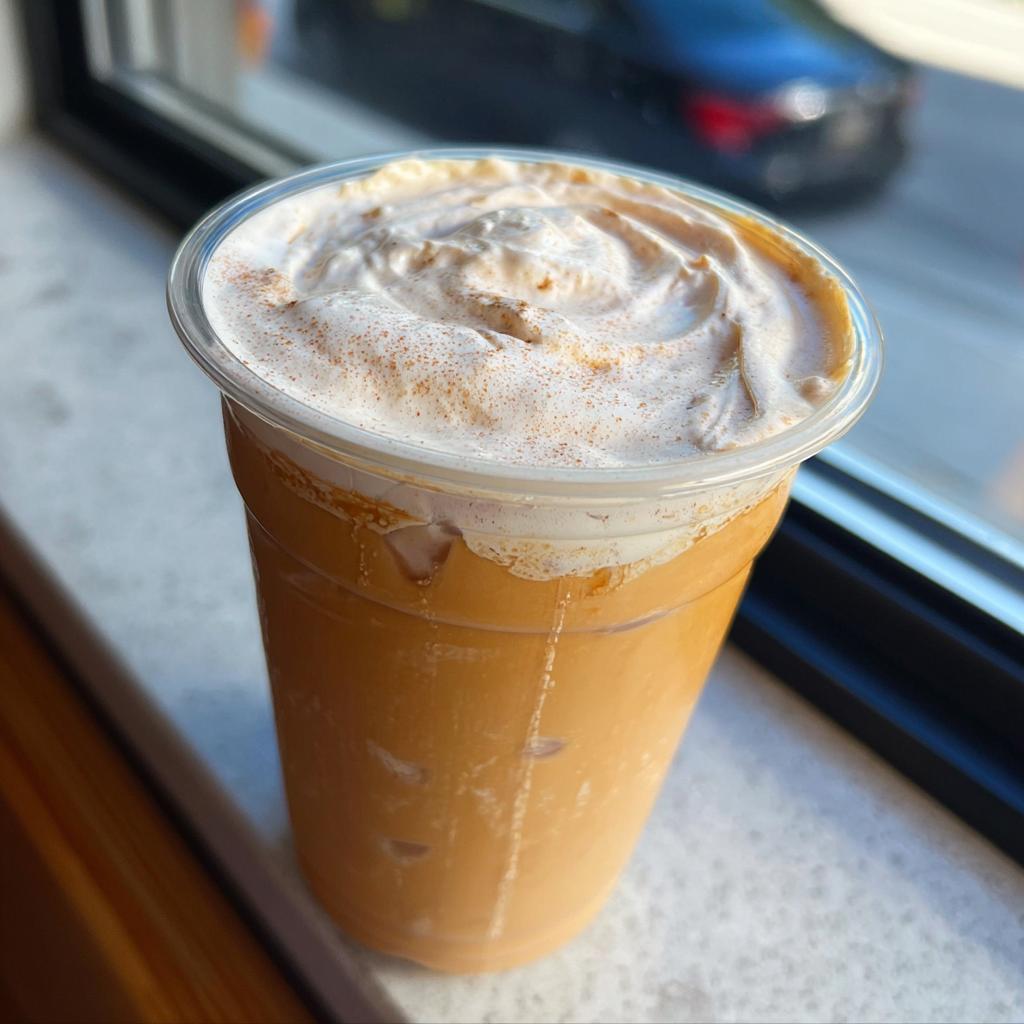 A refreshing iced pumpkin spice latte with whipped cream and cinnamon, a perfect Starbucks drink recipe at home.