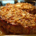 Close-up of a juicy pork chop with a crispy, golden-brown topping, part of a quick pork chops recipe.