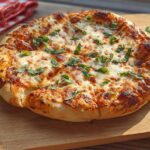 A golden-brown, freshly baked pizza with melted cheese and fresh basil, perfect for restaurant-style pizza night at home.