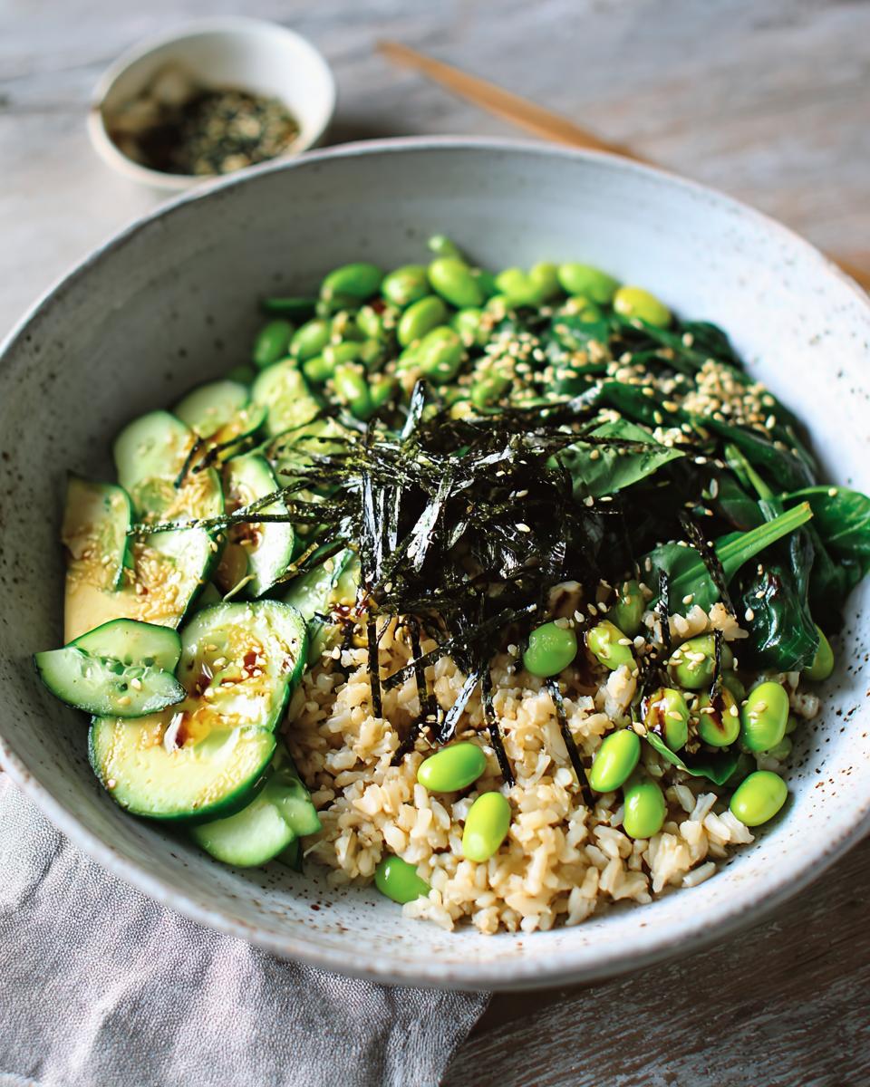 A vibrant and healthy rice bowl with brown rice, edamame, cucumber, spinach, and nori, part of The Ultimate Rice Bowls Recipes Guide for Beginners.