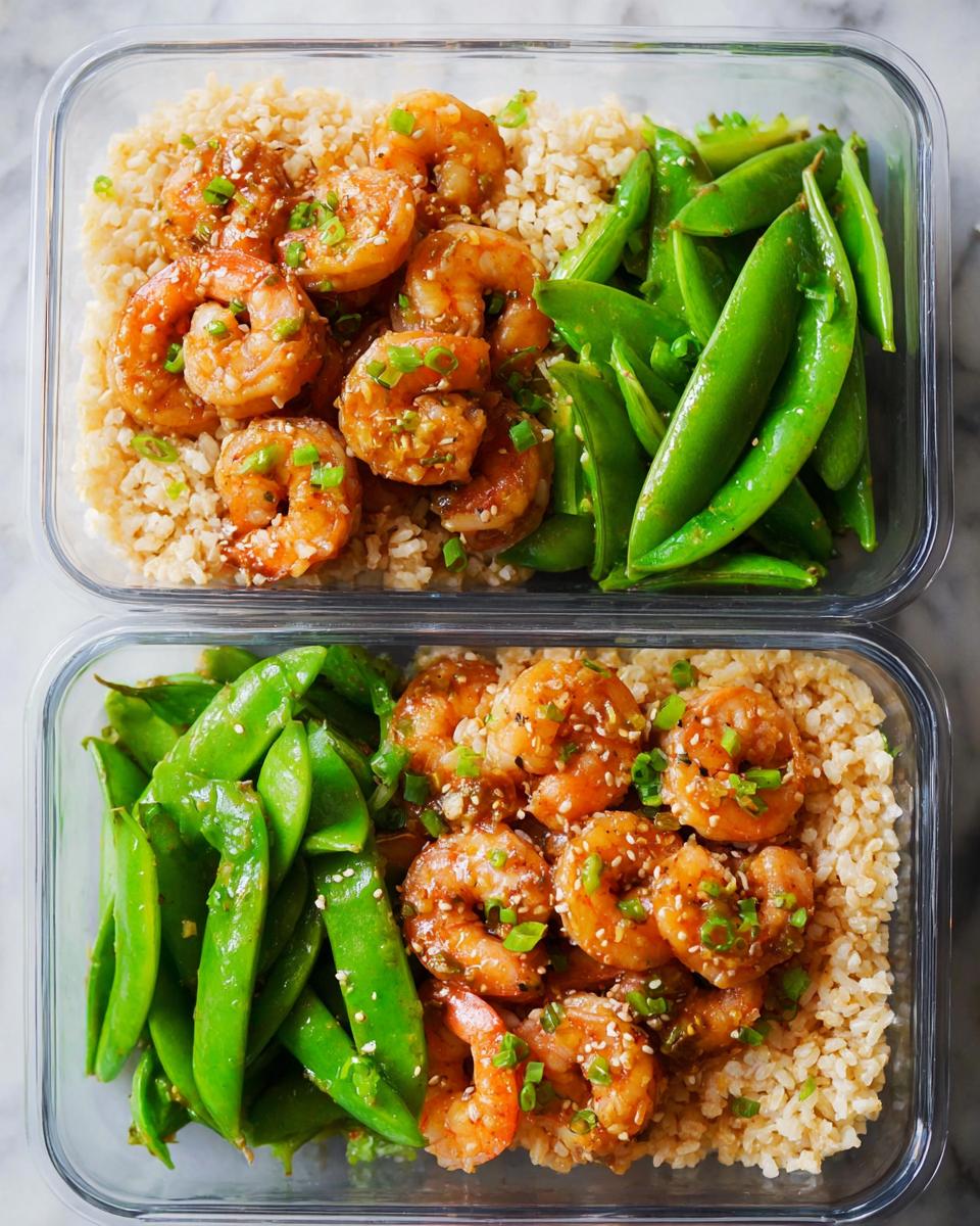 Two glass meal prep containers filled with brown rice, glazed shrimp, and snow peas, perfect for shrimp recipes meal prep.