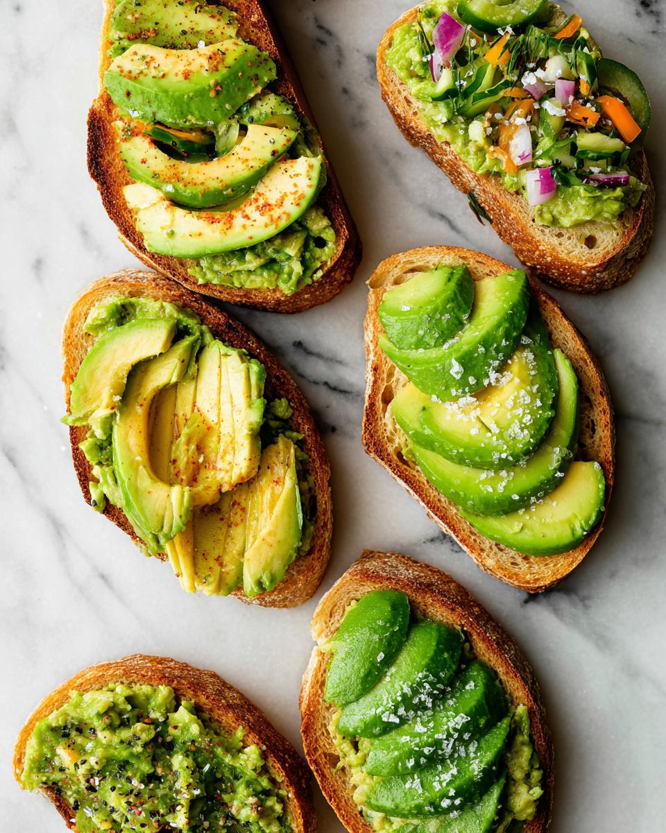 A variety of delicious avocado toast recipes topped with sliced avocado, mashed avocado, and fresh vegetables.