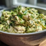 Close-up of creamy avocado tuna salad with fresh parsley, perfect for healthy lunch ideas.