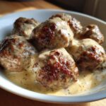 A bowl of delicious Swedish meatballs in a creamy sauce, perfect for ground beef recipes.