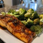 A glistening fillet of honey garlic salmon served with roasted broccoli florets, a perfect easy dinner recipe.